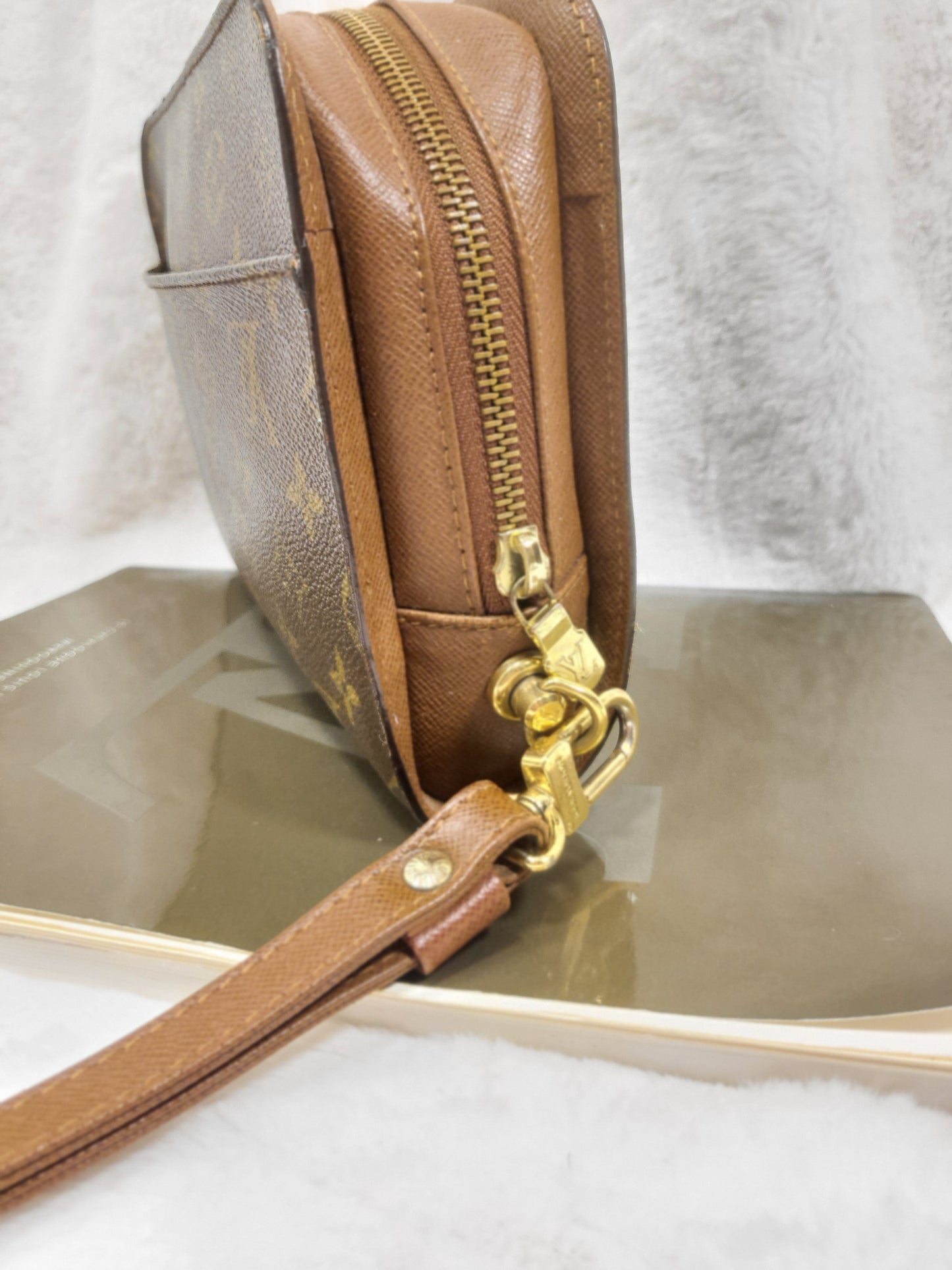Authentic pre-owned Louis Vuitton Orsay monogram clutch