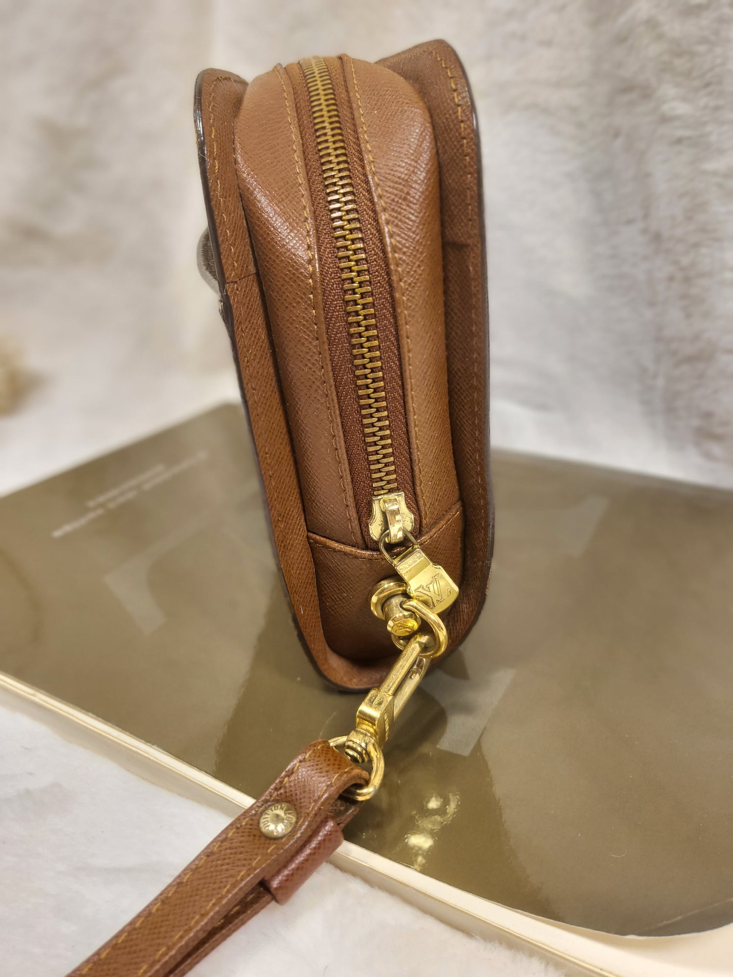 Authentic pre-owned Louis Vuitton Orsay monogram clutch