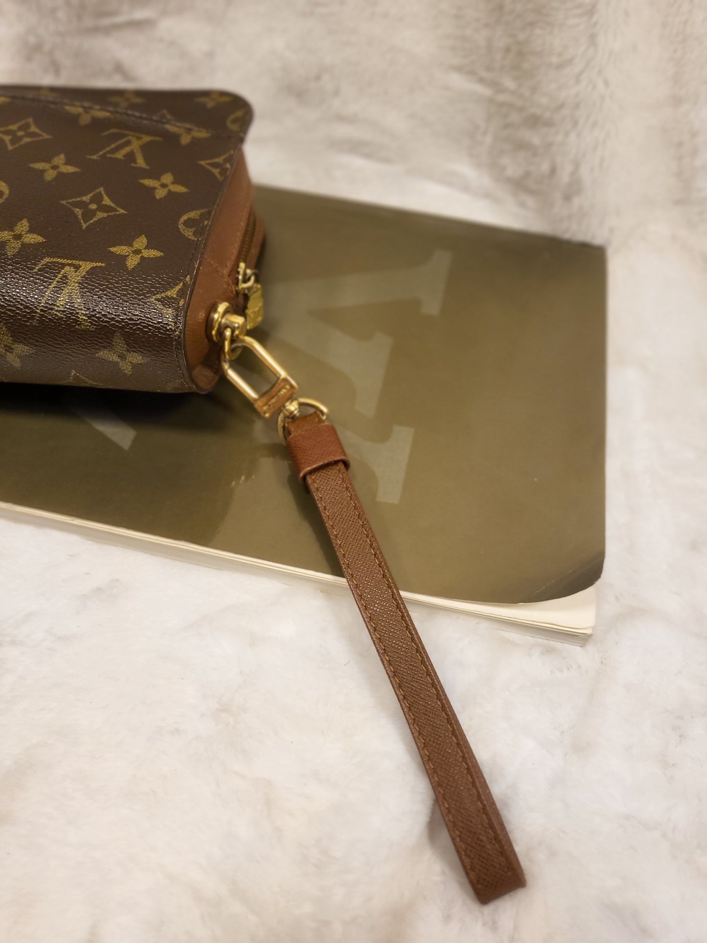 Authentic pre-owned Louis Vuitton Orsay monogram clutch