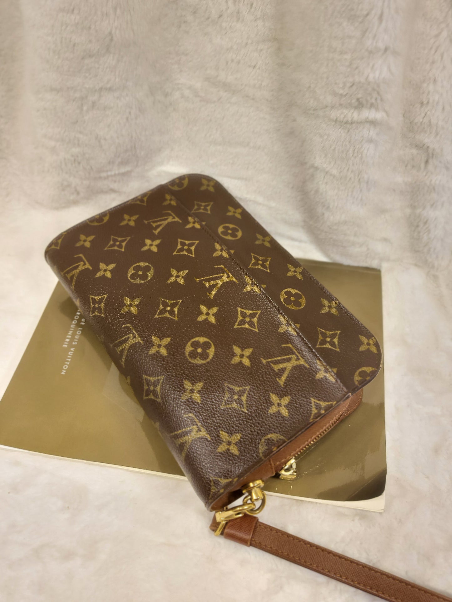 Authentic pre-owned Louis Vuitton Orsay monogram clutch