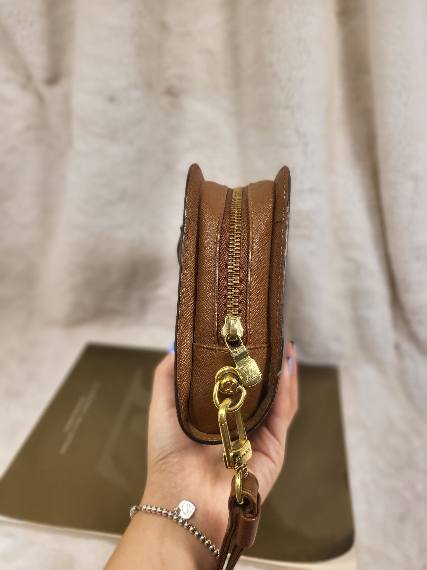 Authentic pre-owned Louis Vuitton Orsay monogram clutch
