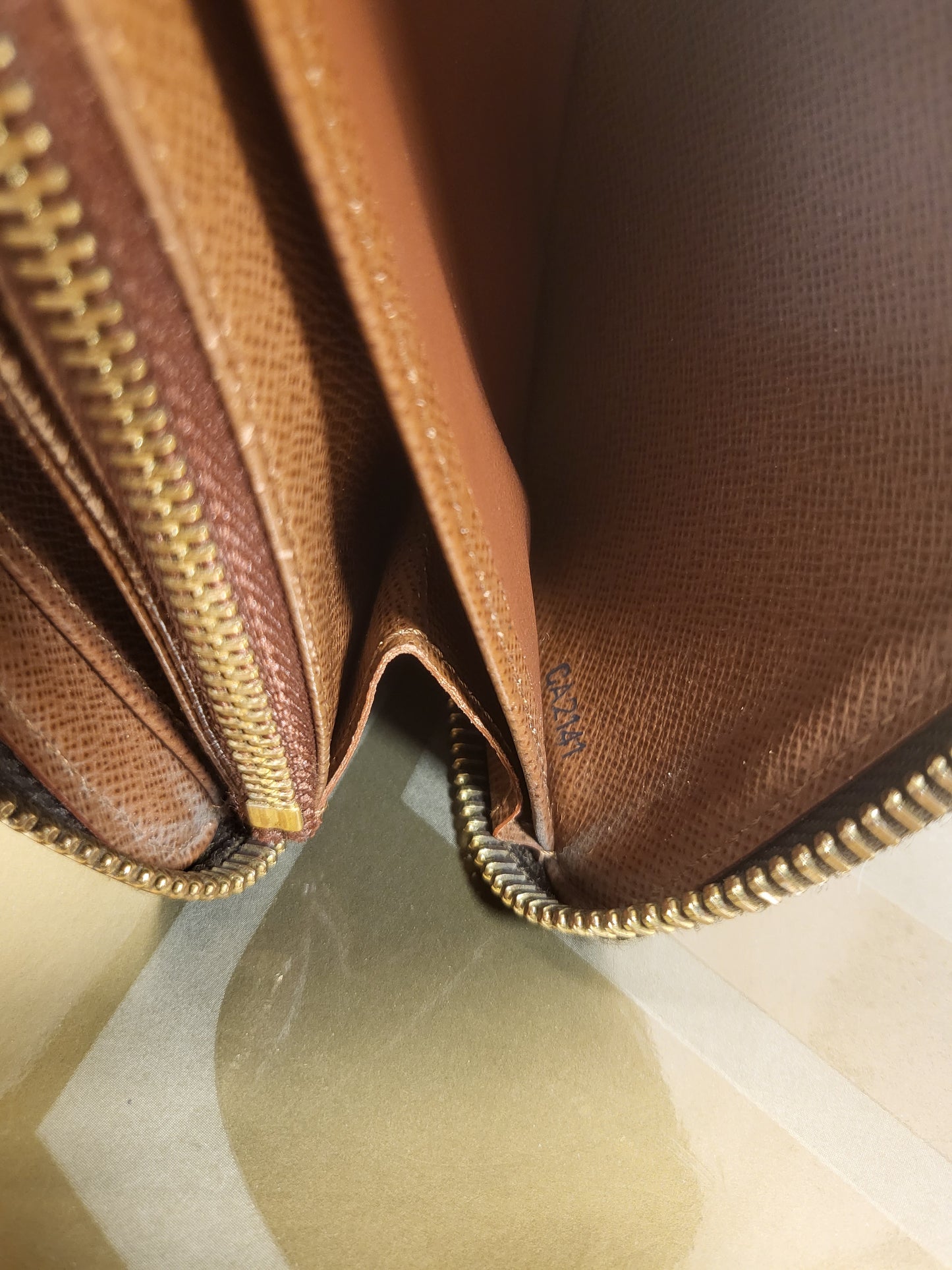 Authentic pre-owned Louis Vuitton Zippy compact wallet