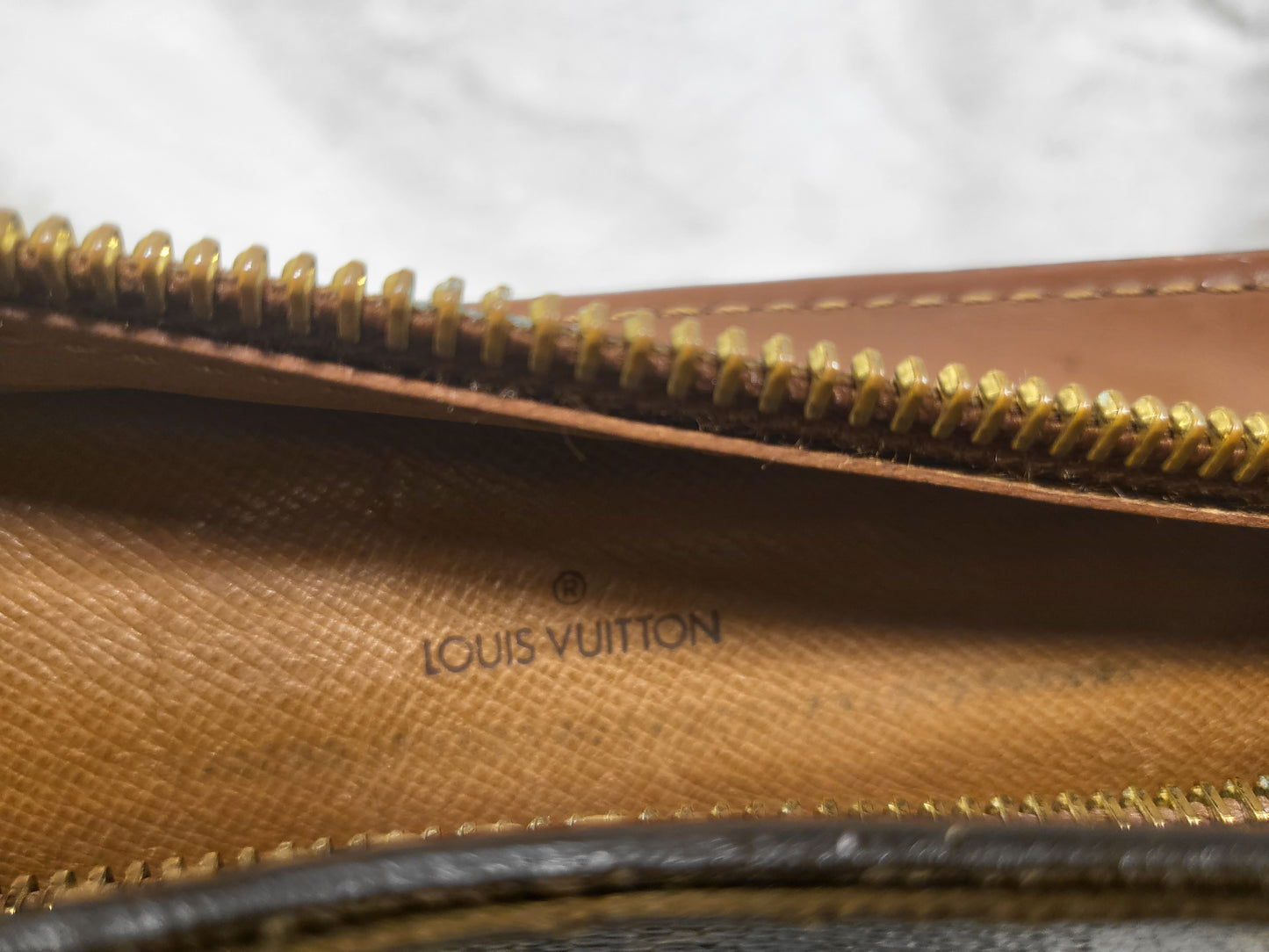 Authentic pre-owned Louis Vuitton Pochette Homme clutch