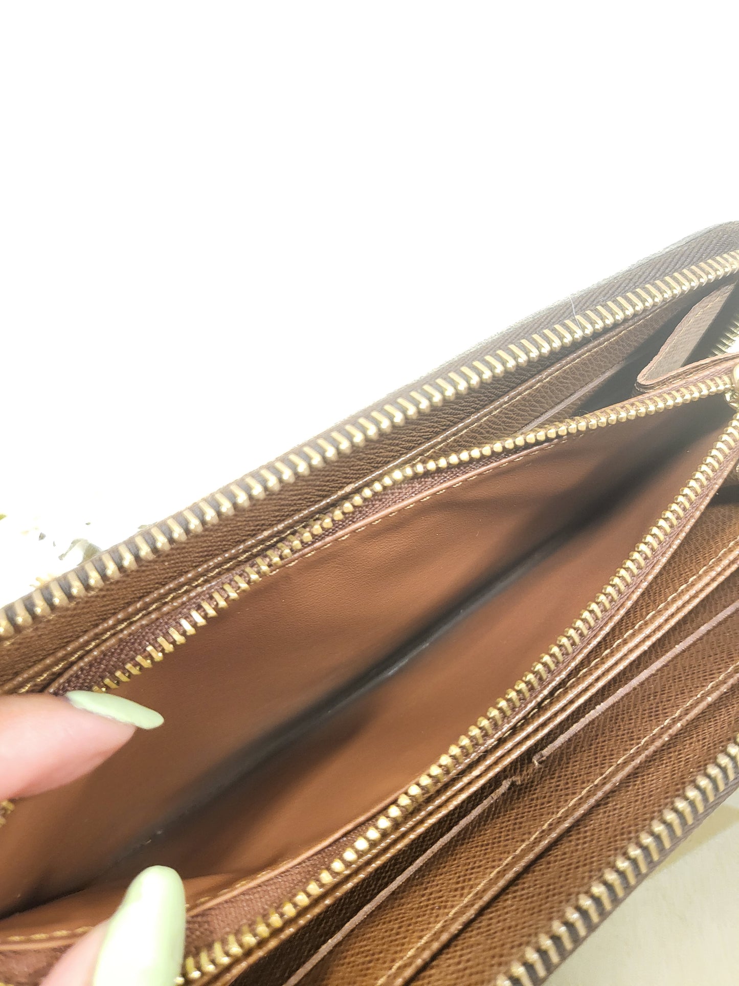 Authentic pre-owned Louis Vuitton Zippy wallet monogram