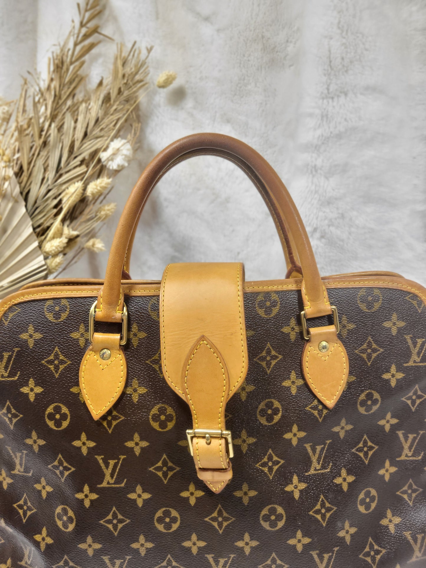 Authentic pre-owned Louis Vuitton Rivoli briefcase