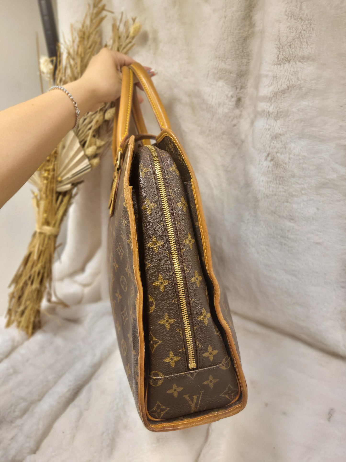 Authentic pre-owned Louis Vuitton Rivoli briefcase