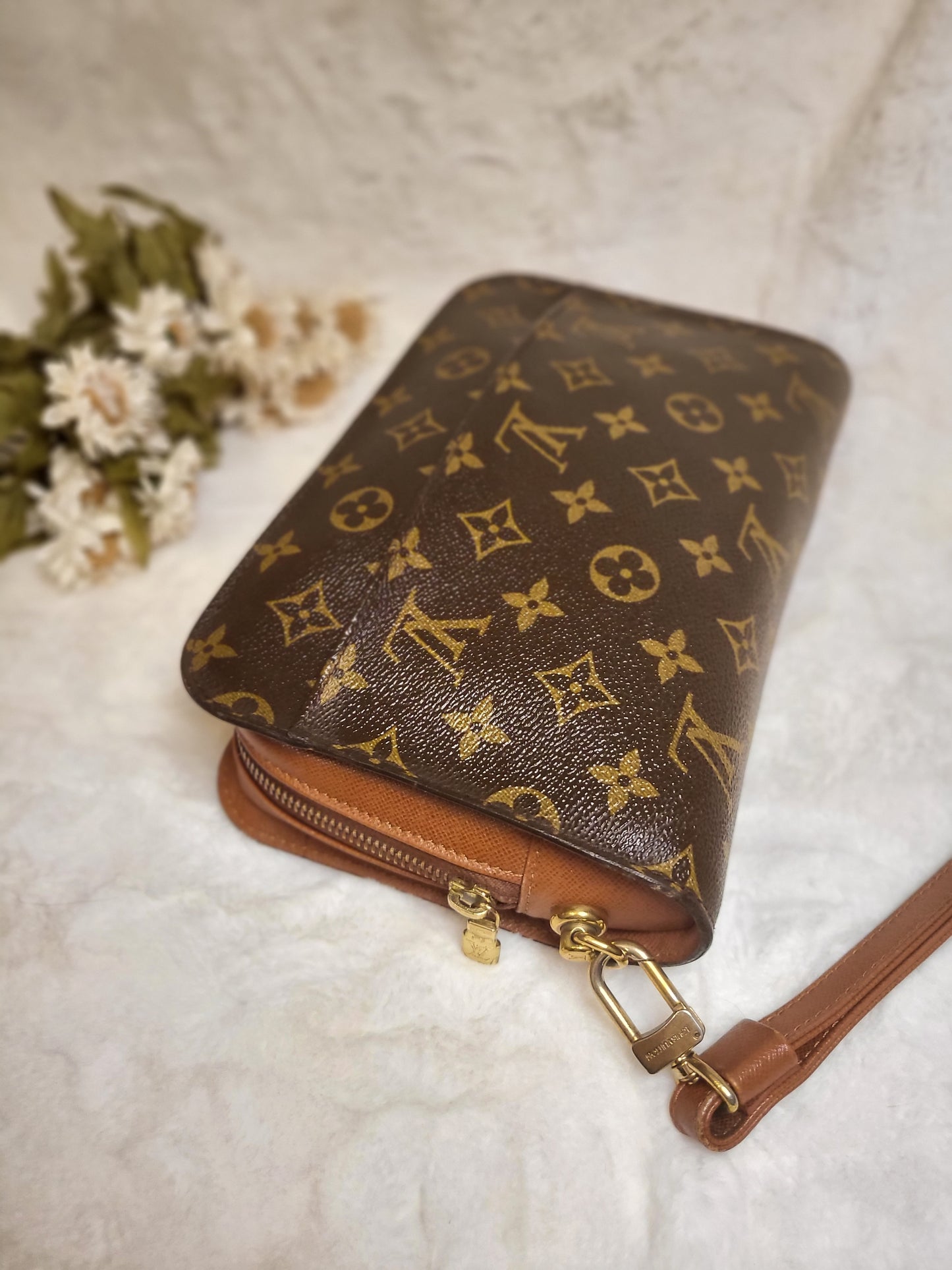 Authentic pre-owned Louis Vuitton Orsay monogram clutch