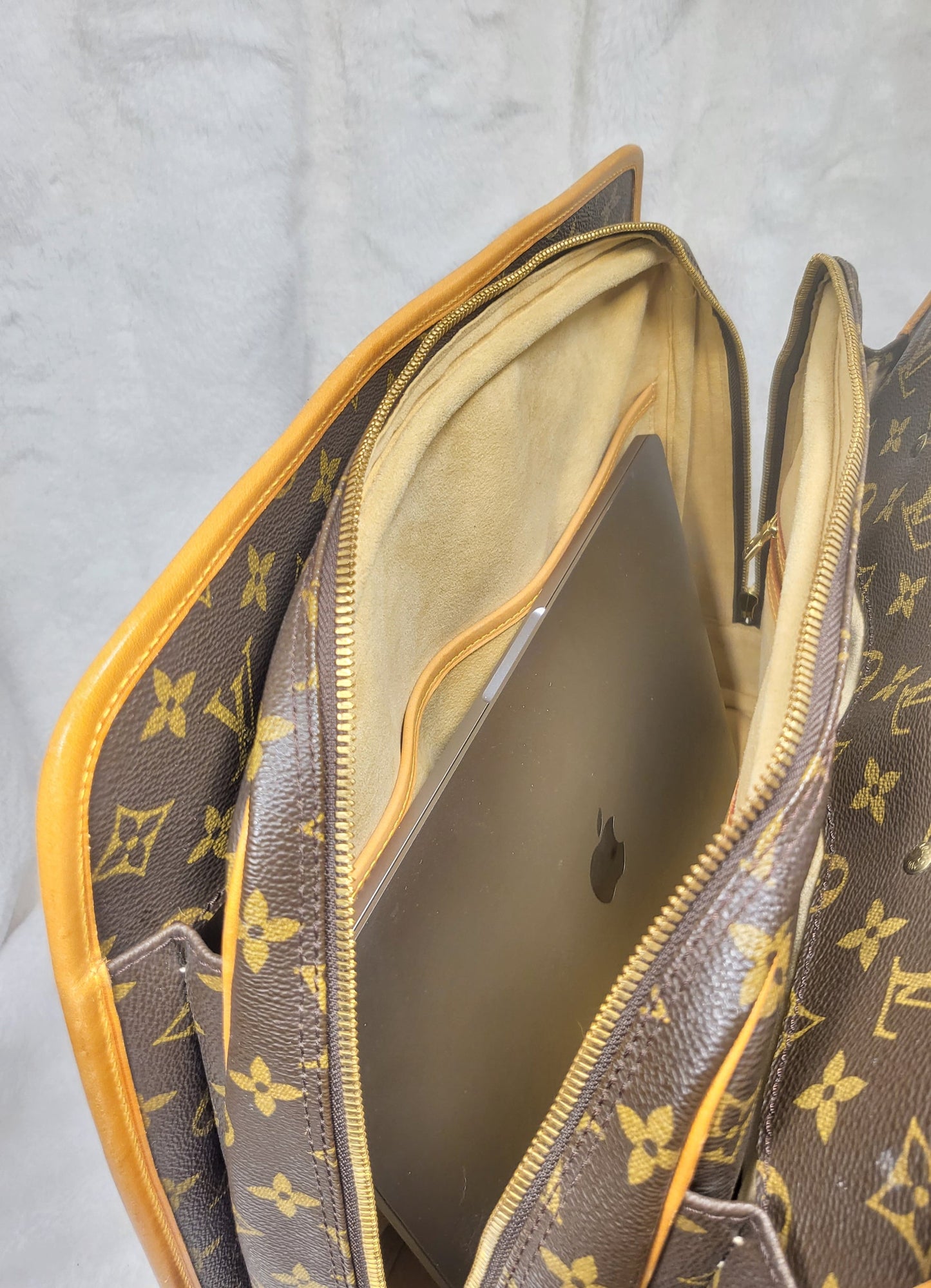 Authentic pre-owned Louis Vuitton Rivoli briefcase