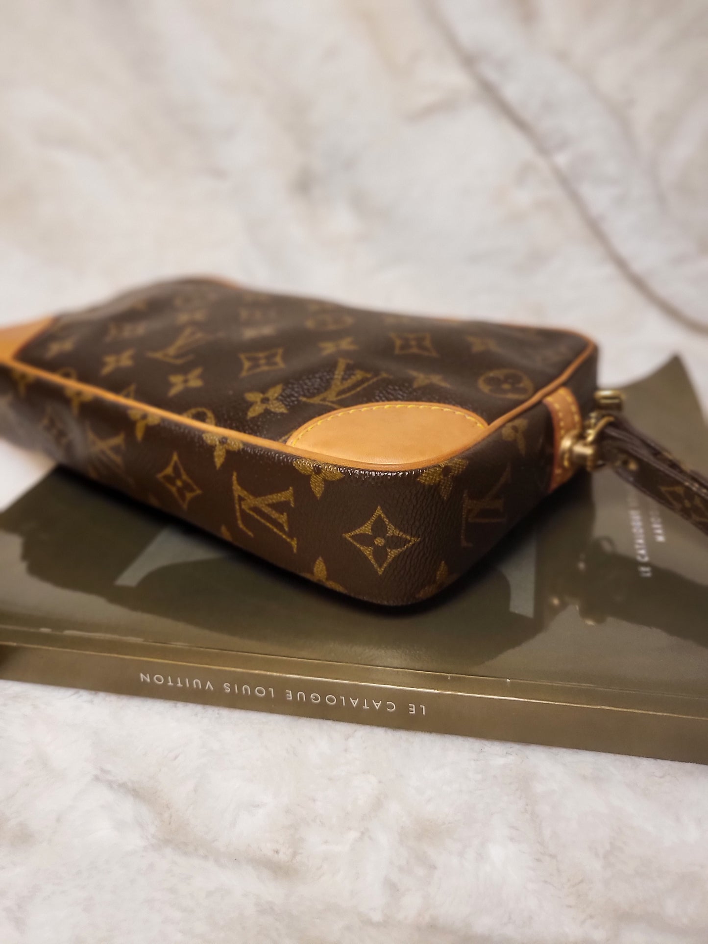 Authentic pre-owned Louis Vuitton Marly Dragonne clutch