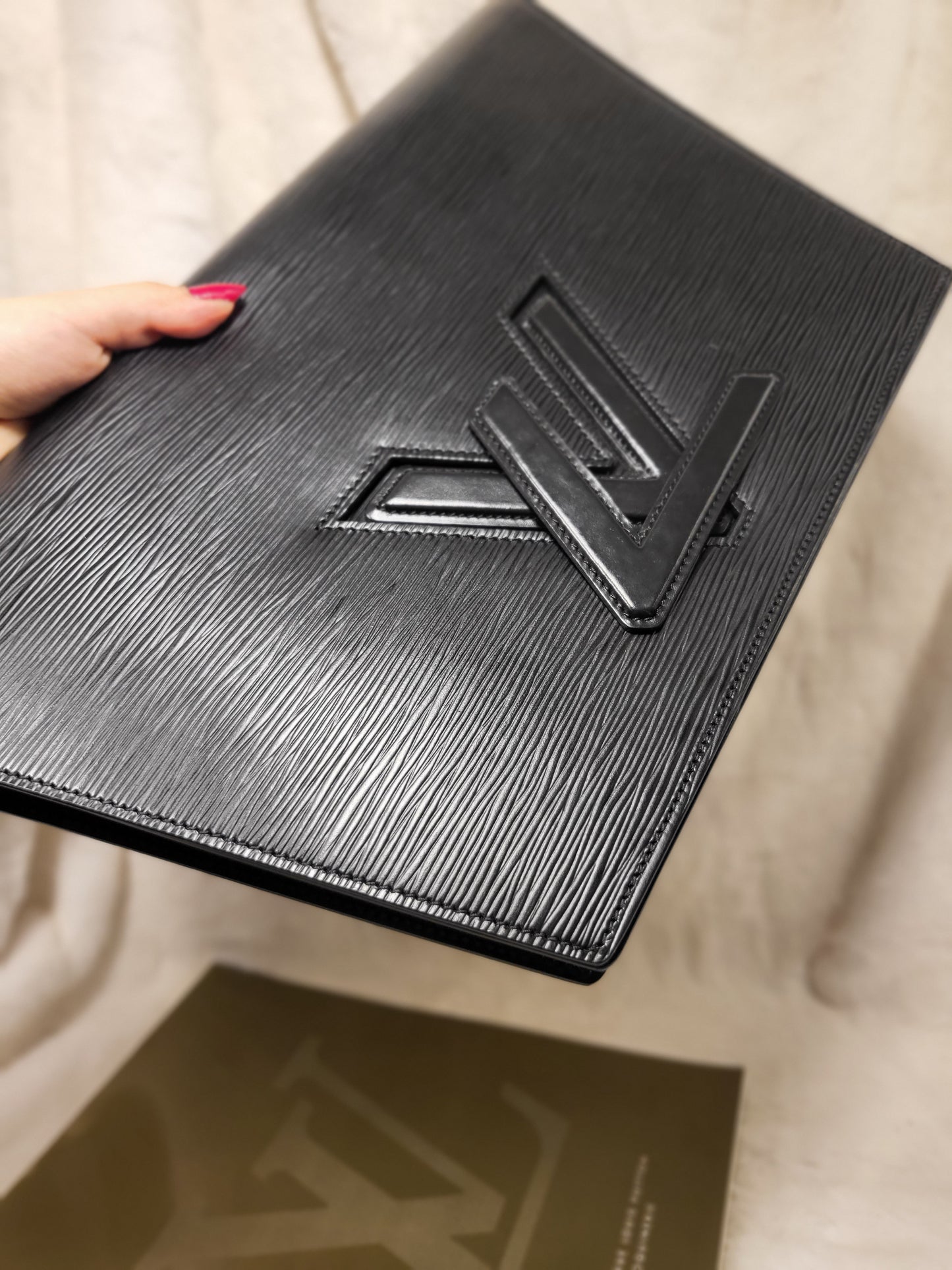 Authentic pre-owned Louis Vuitton trapezoid epi clutch