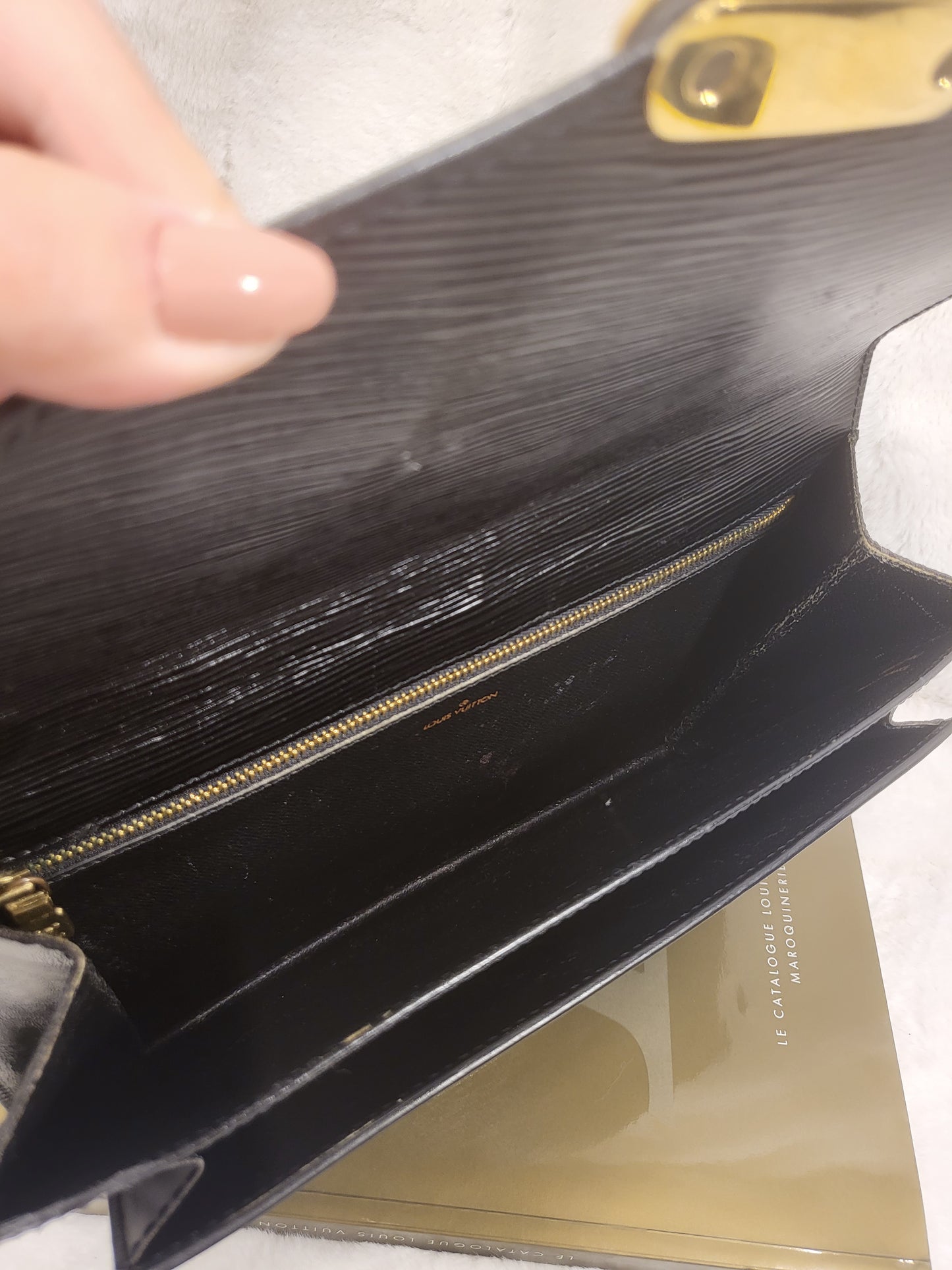 Authentic pre-owned Louis Vuitton Serie Dragonne noir epi clutch