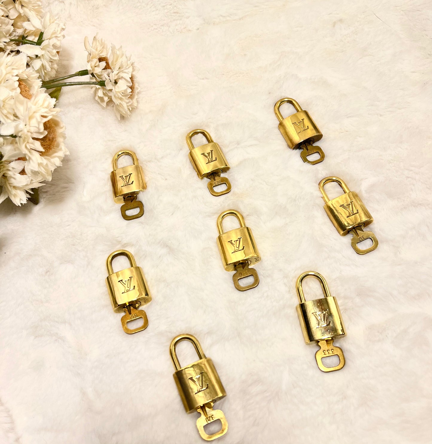 Authentic pre-owned Louis Vuitton lock & key set