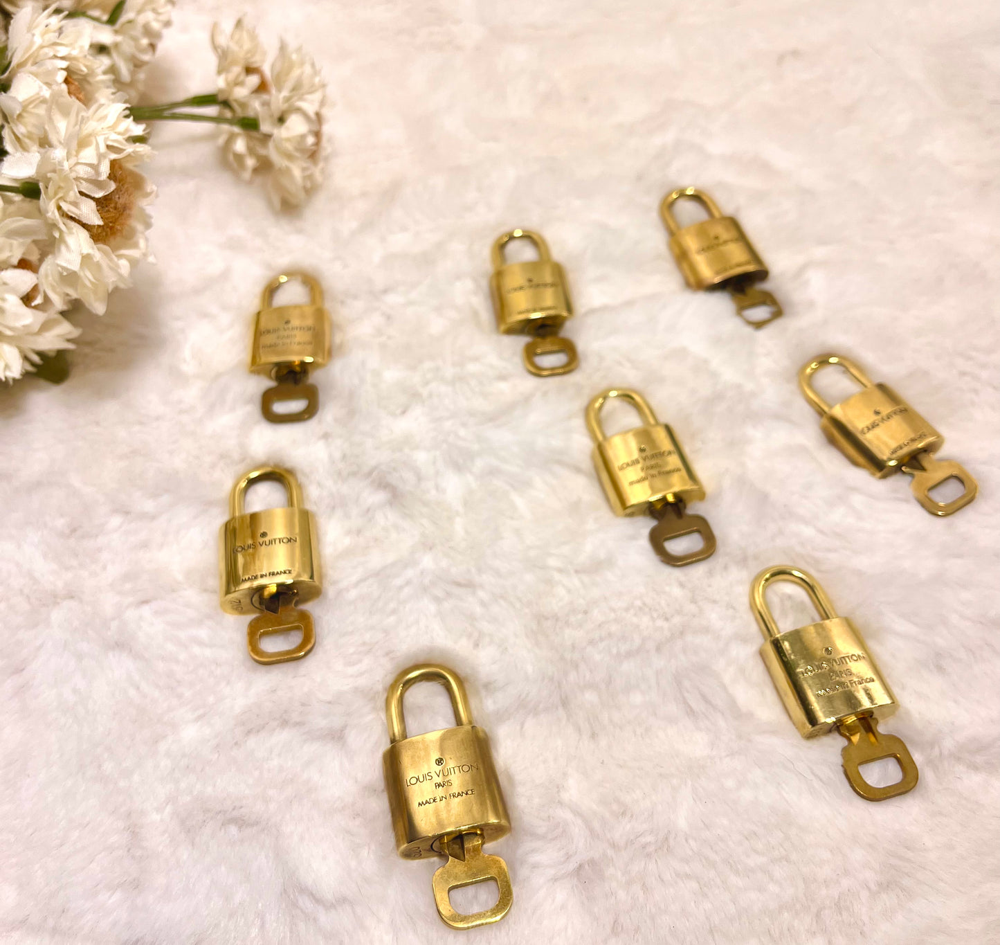 Authentic pre-owned Louis Vuitton lock & key set