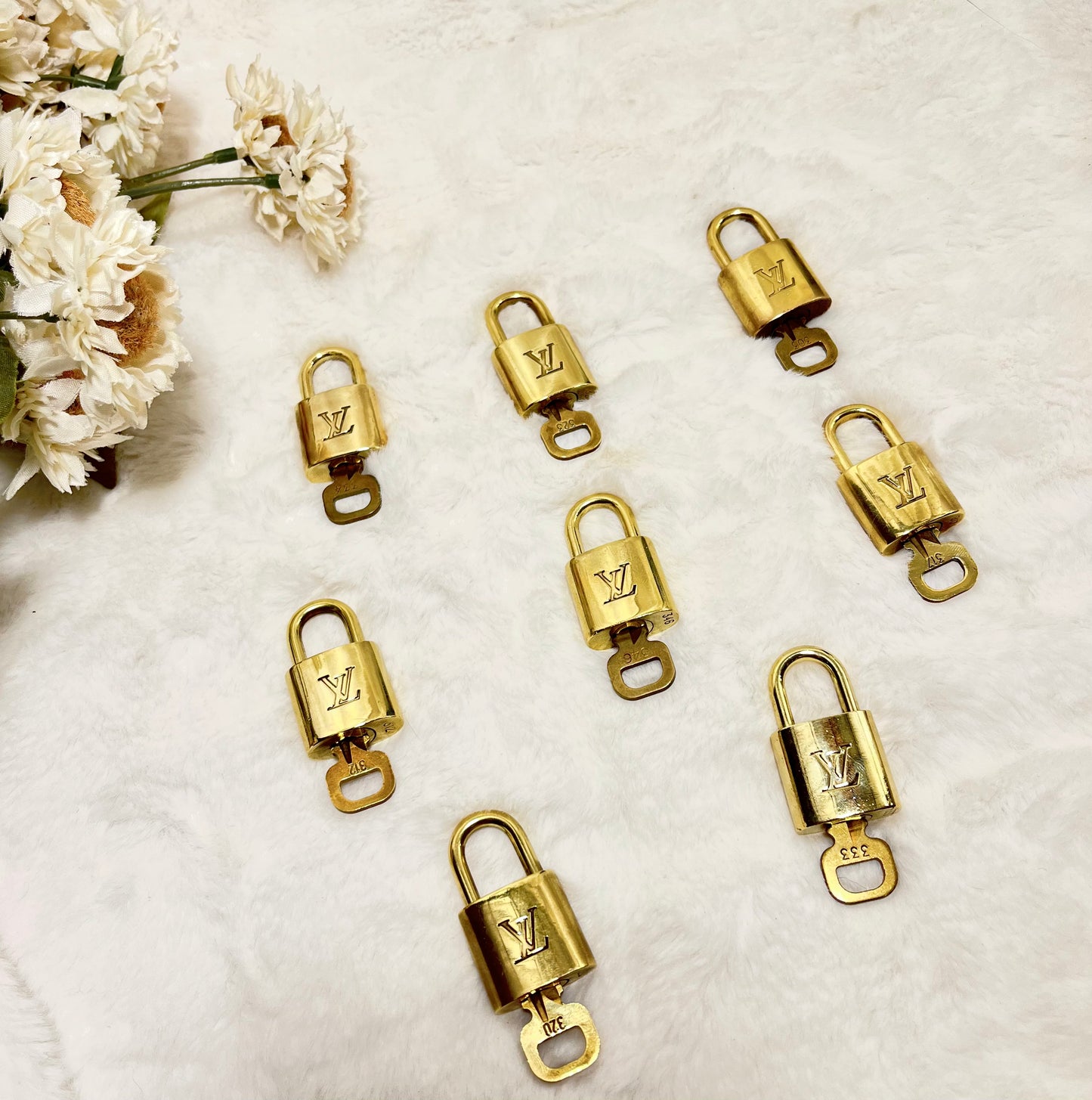 Authentic pre-owned Louis Vuitton lock & key set