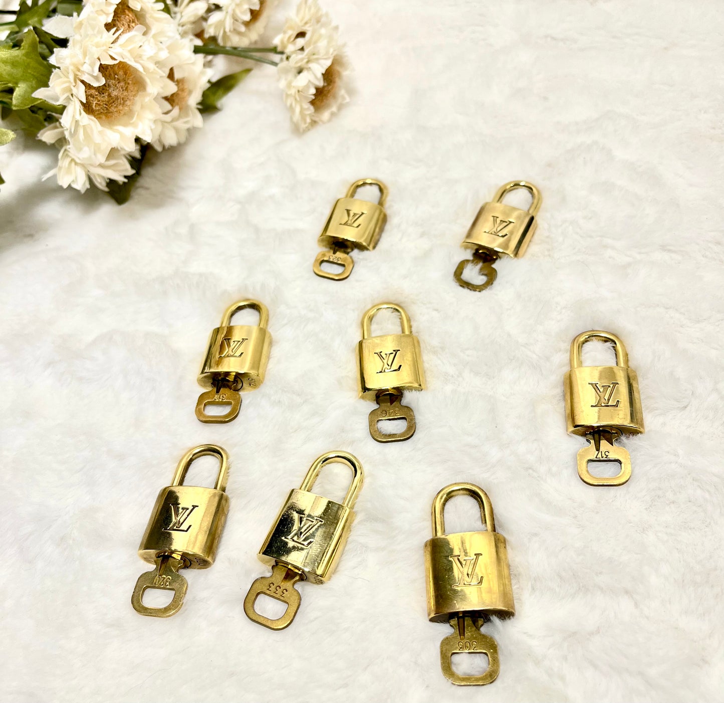 Authentic pre-owned Louis Vuitton lock & key set
