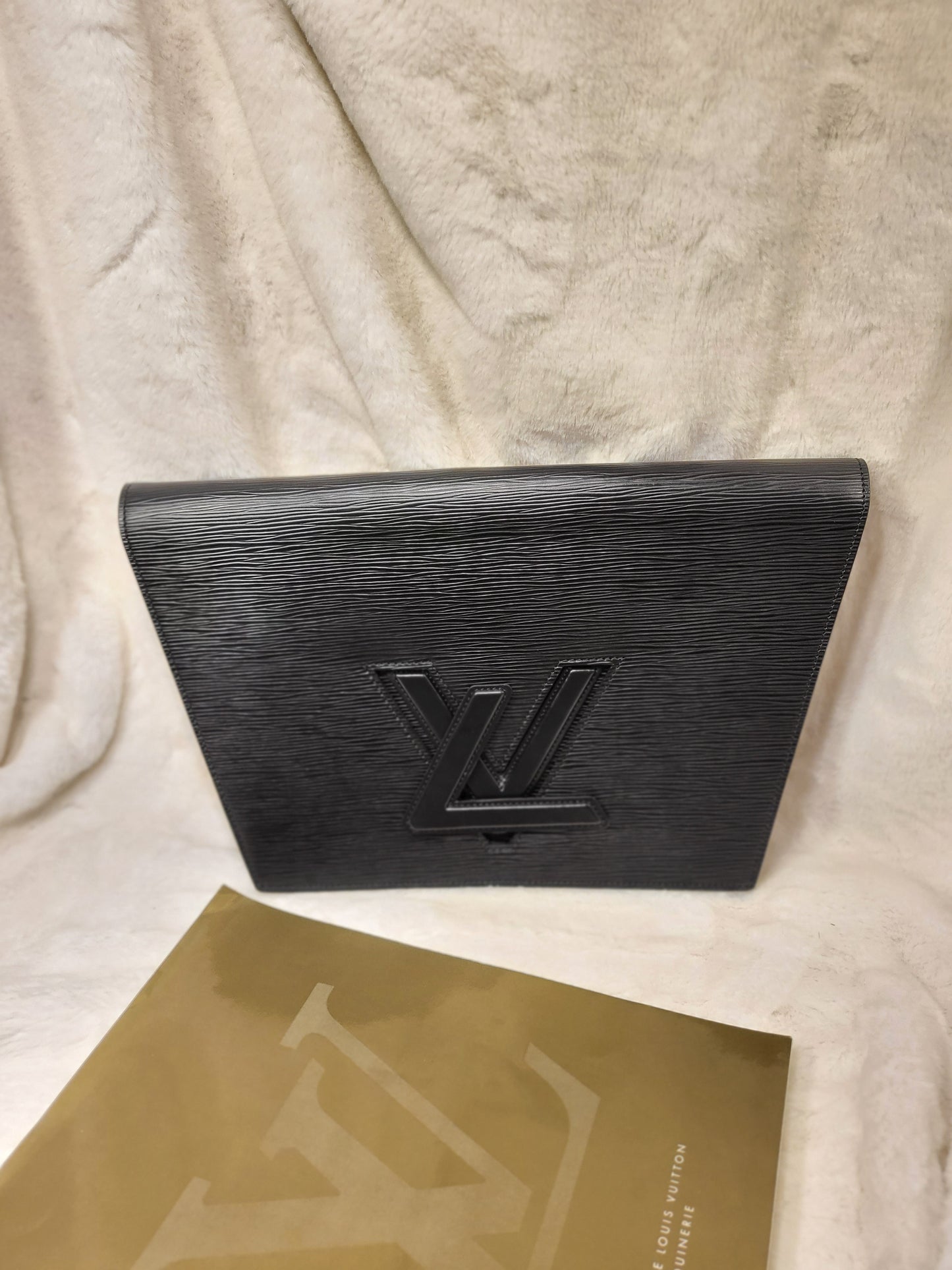 Authentic pre-owned Louis Vuitton trapezoid epi clutch